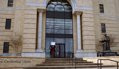 Way over there...that's me on the steps of the Chan Shun Centennial Library on our campus. Can I help it if no one else is up at 8 a.m.?